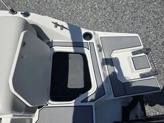 Slide: The Image of Starcraft 2025 SV 16 OB boat with open storage compartment lid. - 26