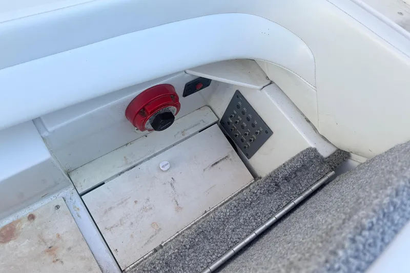 Slide: The Image of Interior view of a 1999 Formula 312 FASTech boat showing control panel and carpeted flooring. - 10