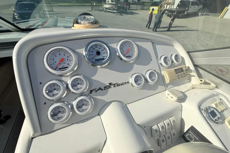 Slide: The Image of 1999 Formula 312 FASTech dashboard with gauges and controls in a boat cockpit. - 15