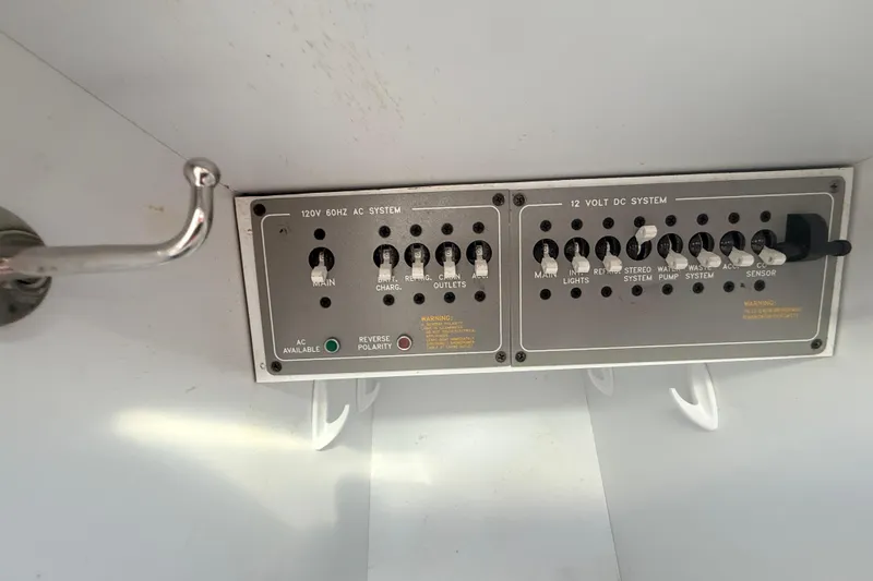 Slide: The Image of Control panel of a 1999 Formula 312 FASTech boat, featuring AC and DC systems. - 3