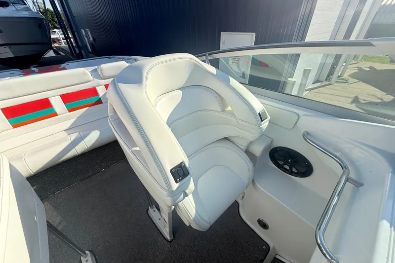 Slide: The Image of 1999 Formula 312 FASTech boat interior with white seating and colorful accents. - 7
