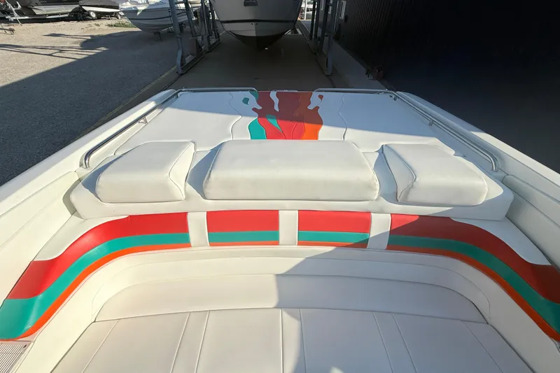Slide: The Image of 1999 Formula 312 FASTech boat interior with colorful upholstery design. - 9