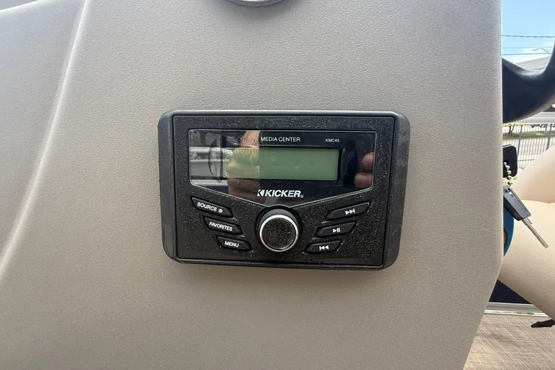 Slide: The Image of Kicker media center on 2022 Sun Tracker Bass Buggy 16 DLX boat dashboard. - 15