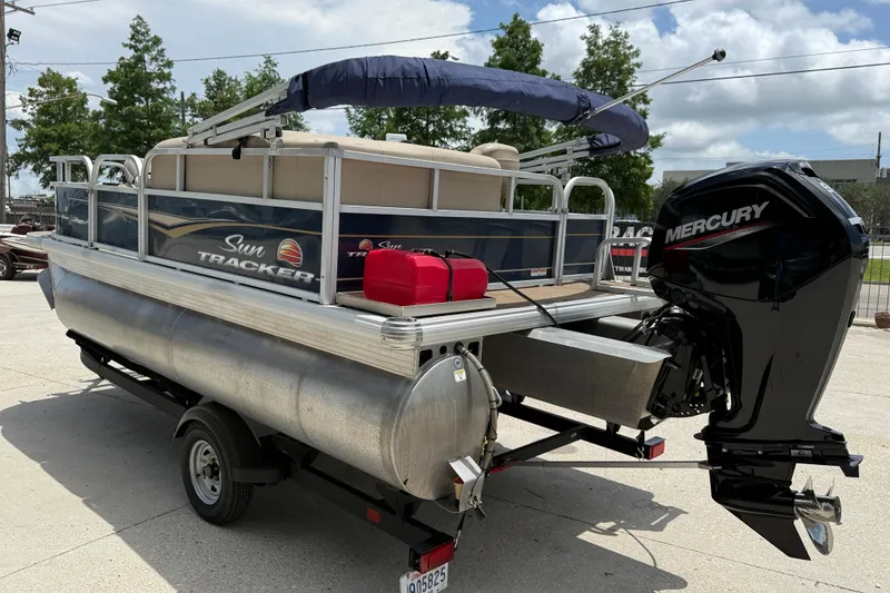 Slide: The Image of 2022 Sun Tracker Bass Buggy 16 DLX pontoon boat with Mercury outboard motor. - 3