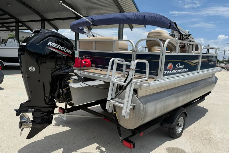 Slide: The Image of 2022 Sun Tracker Bass Buggy 16 DLX pontoon boat with Mercury outboard motor. - 5