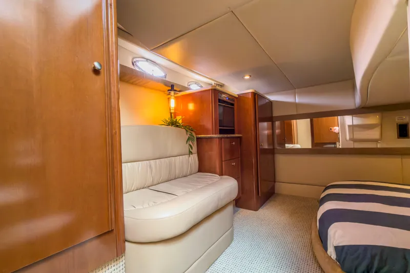 Slide: The Image of Luxurious interior of 2005 Meridian 411 Sedan yacht with plush seating and elegant wood finishes. - 13