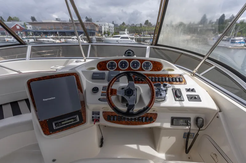 Slide: The Image of Helm of 2005 Meridian 411 Sedan yacht with navigation controls and steering wheel. - 18