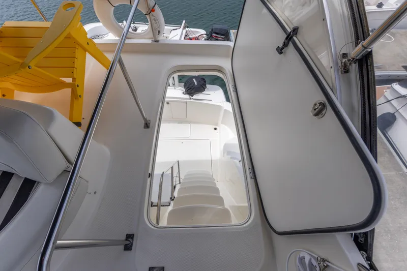 Slide: The Image of Interior view of a 2005 Meridian 411 Sedan yacht, featuring stairs and seating. - 19