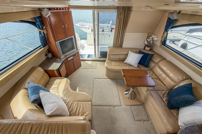 Slide: The Image of Luxurious interior of 2005 Meridian 411 Sedan yacht with leather seating and TV. - 2