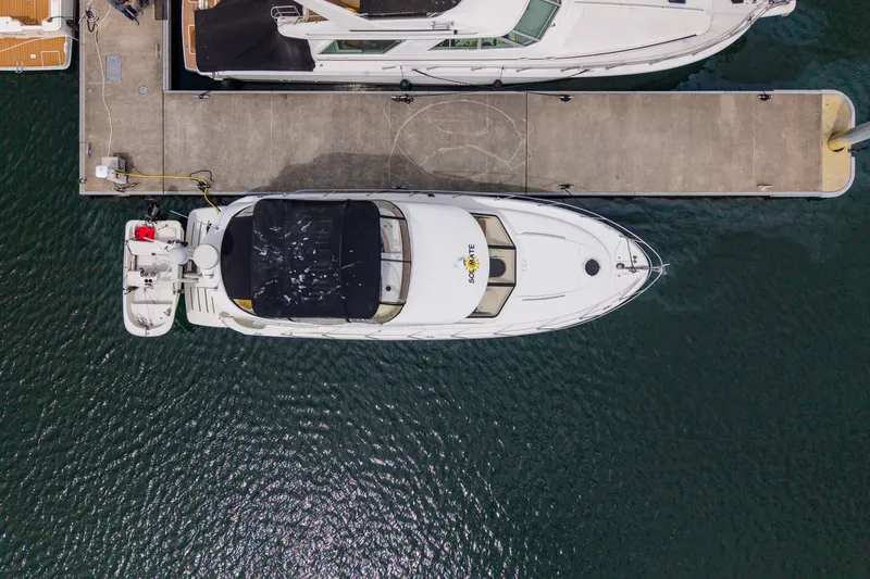 Slide: The Image of Aerial view of a 2005 Meridian 411 Sedan yacht docked at a marina. - 30