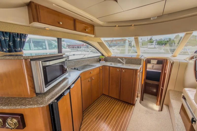 Slide: The Image of Luxurious 2005 Meridian 411 Sedan yacht interior with modern kitchen and panoramic windows. - 6