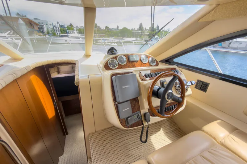 Slide: The Image of 2005 Meridian 411 Sedan yacht helm with luxurious interior and waterfront view. - 8