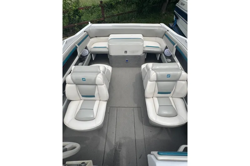 Slide: The Image of 1994 Four Winns 200 Horizon boat interior with white and gray seating. - 12