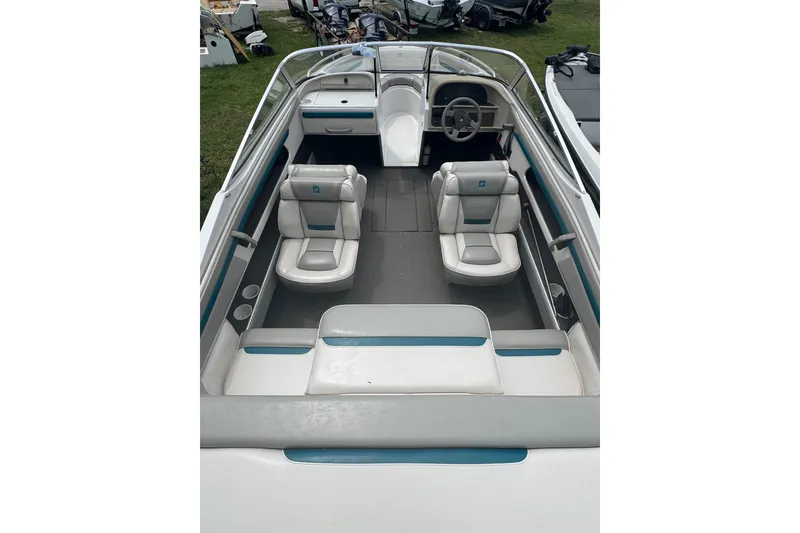 Slide: The Image of 1994 Four Winns 200 Horizon boat interior with white and blue seating. - 7