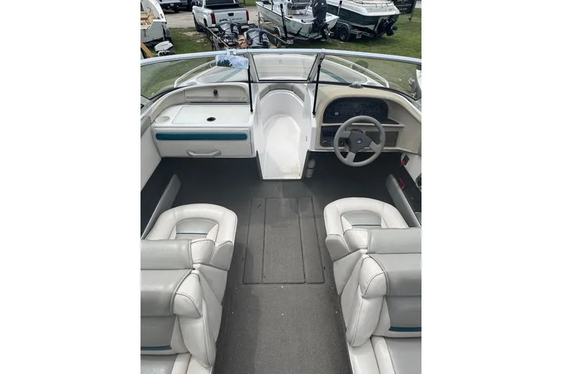 Slide: The Image of 1994 Four Winns 200 Horizon boat interior with steering wheel and seating. - 8