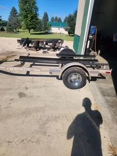 Slide: The Image of Crownline 18 SS 2012 boat trailer parked outdoors. - 13