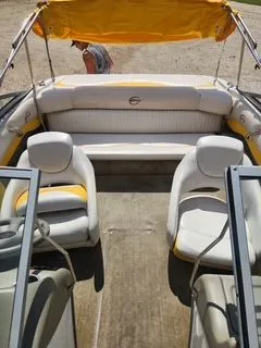 Slide: The Image of Interior of a 2012 Crownline 18 SS boat with yellow canopy. - 16