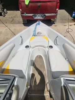 Slide: The Image of 2012 Crownline 18 SS boat, front view, hitched to red vehicle. - 17