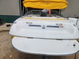 Slide: The Image of 2012 Crownline 18 SS boat with yellow canopy, rear view. - 4