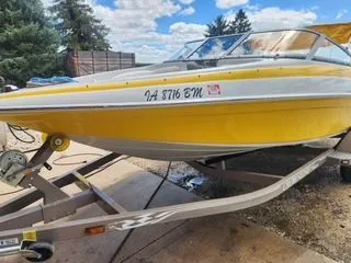 Slide: The Image of Yellow 2012 Crownline 18 SS boat on trailer, side view. - 6