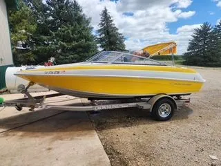 Slide: The Image of Yellow 2012 Crownline 18 SS boat on trailer, sunny day. - 7