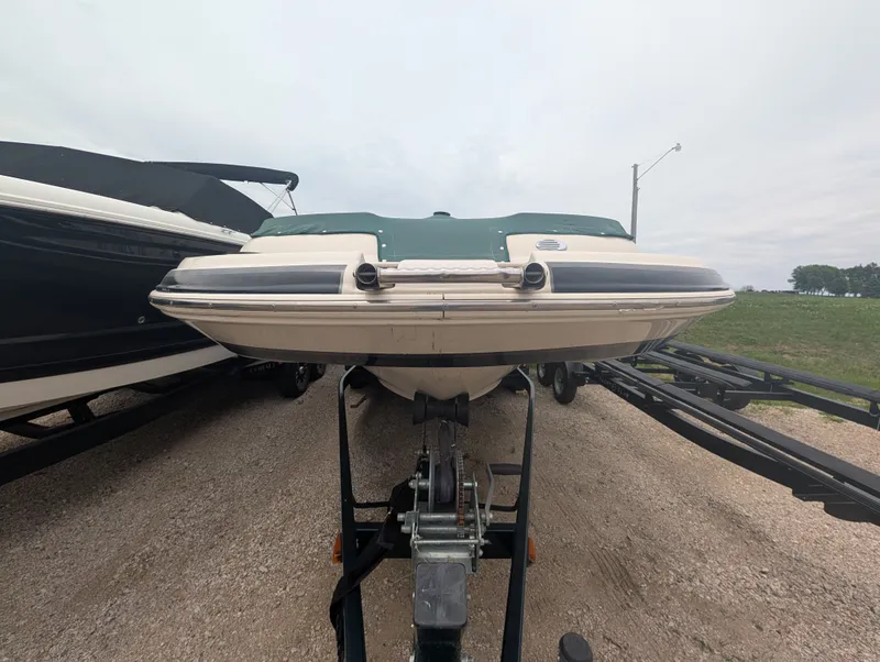 Slide: The Image of 2004 Larson Escape 234 boat on trailer, front view. - 2