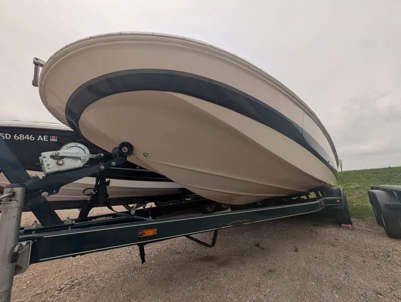 Slide: The Image of 2004 Larson Escape 234 boat on a trailer. - 3