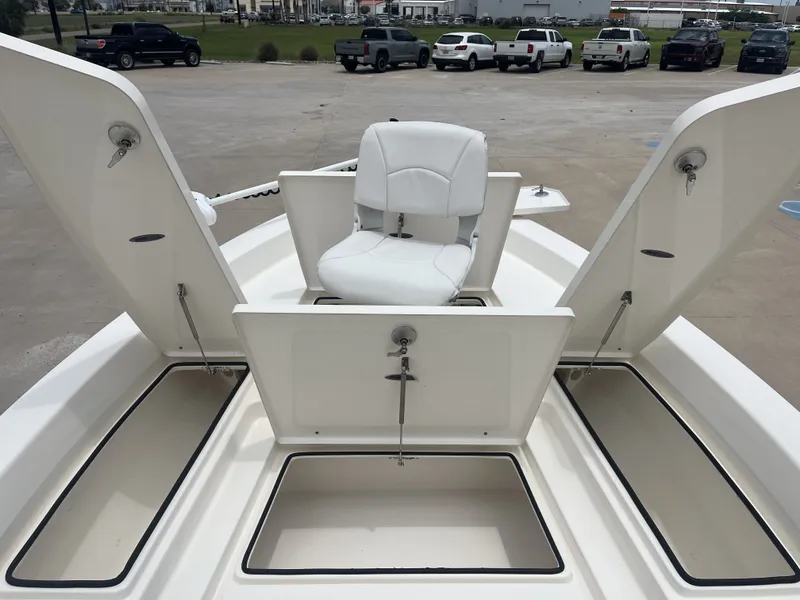Slide: The Image of 2022 Pathfinder 2400 boat with storage compartments and seating. - 13