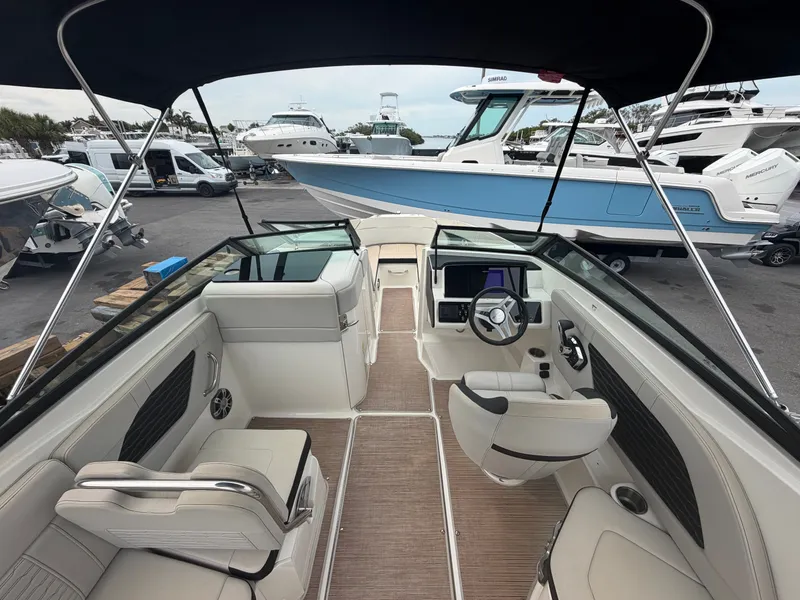 Slide: The Image of Interior view of a modern motorboat with sleek seating and a helm station. - 12