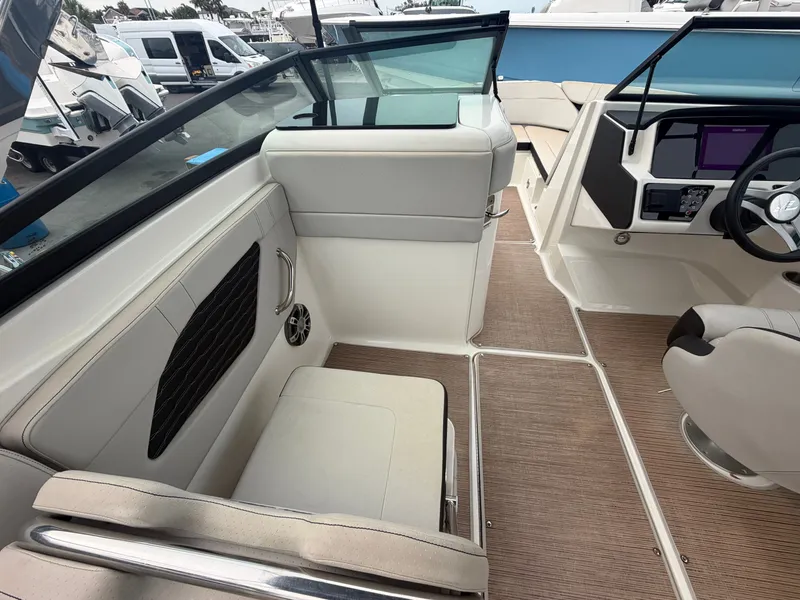 Slide: The Image of Interior view of a modern boat with gray seating and a helm station. - 17