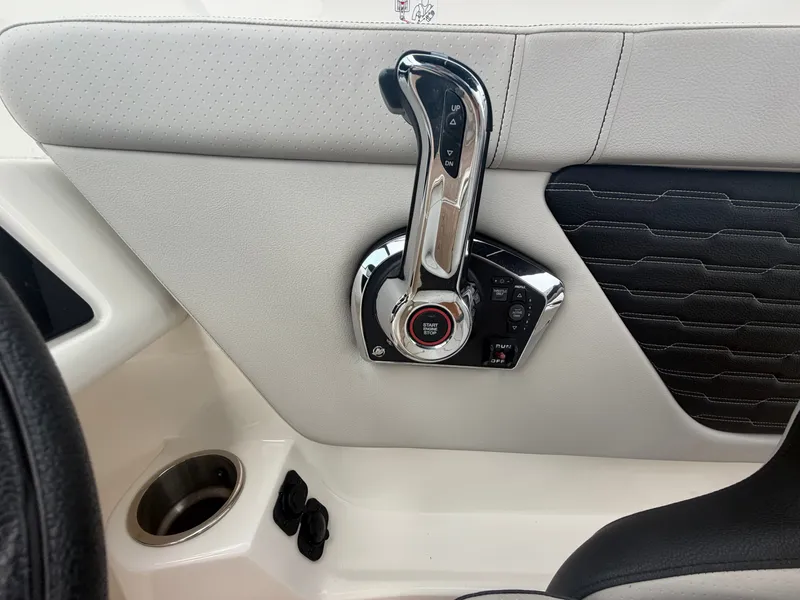 Slide: The Image of Close-up of a boat throttle lever with modern design and leather upholstery. - 21