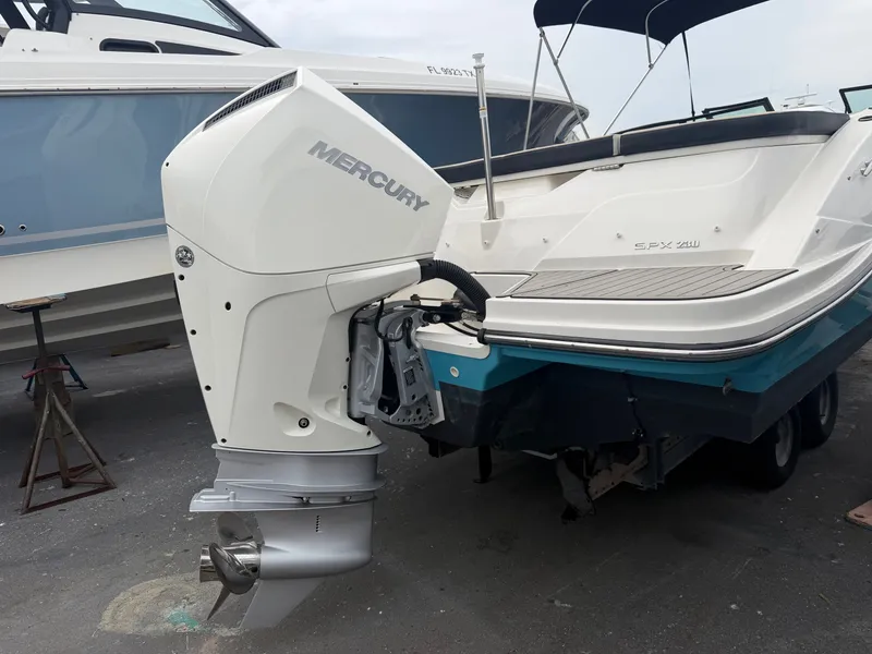 Slide: The Image of A Sea Ray SPX 230 Outboard with a Mercury engine on a trailer. - 7