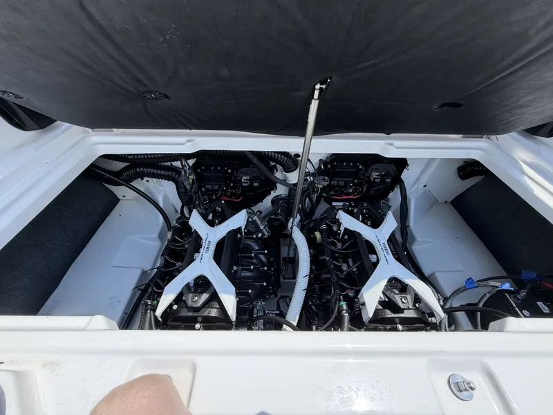 Slide: The Image of Engine compartment of 2024 Yamaha Boats AR250 with dual engines. - 16