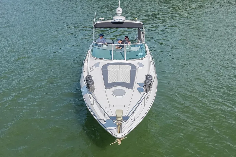 Slide: The Image of 2005 Cruisers Yachts 370 Express on calm water, aerial view. - 14