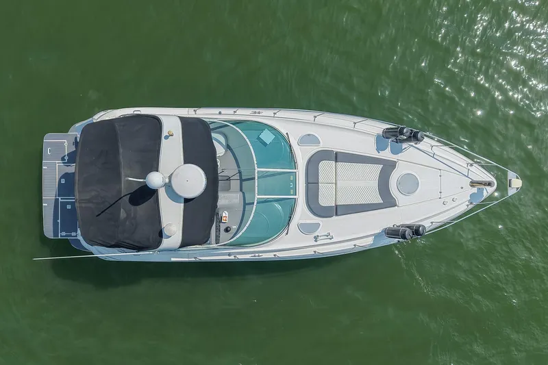 Slide: The Image of Top view of a 2005 Cruisers Yachts 370 Express on green water. - 16