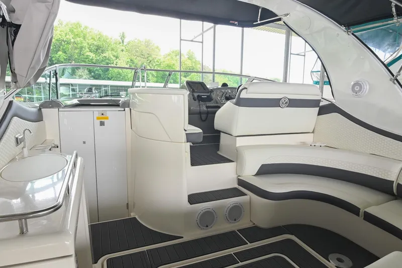 Slide: The Image of Interior of 2005 Cruisers Yachts 370 Express, featuring sleek seating and modern helm controls. - 20