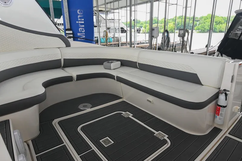 Slide: The Image of Luxurious seating area on a 2005 Cruisers Yachts 370 Express, docked with scenic views. - 21
