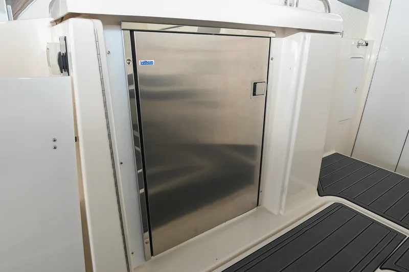 Slide: The Image of Stainless steel fridge on 2005 Cruisers Yachts 370 Express boat deck. - 27