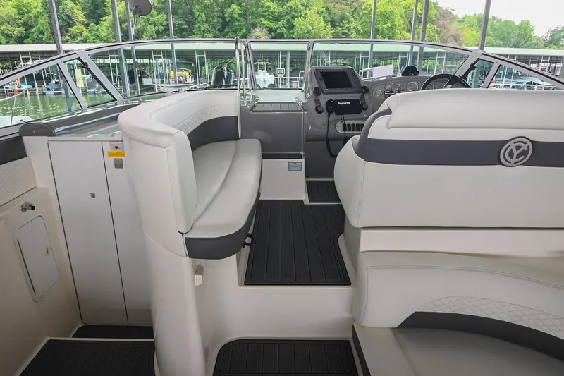 Slide: The Image of 2005 Cruisers Yachts 370 Express cockpit with plush seating and modern controls. - 28