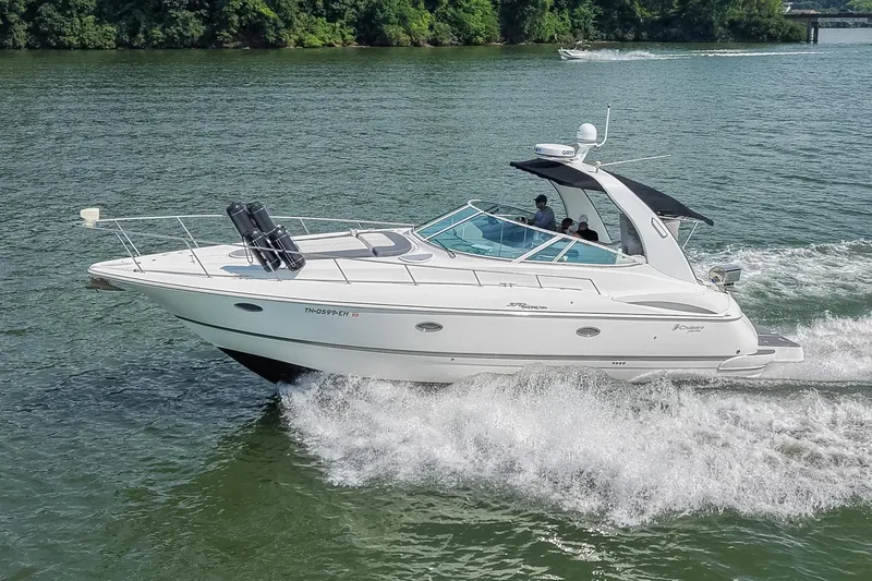 Slide: The Image of 2005 Cruisers Yachts 370 Express cruising on a scenic waterway. - 4