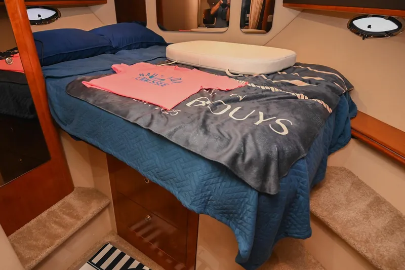 Slide: The Image of Interior cabin of 2005 Cruisers Yachts 370 Express with bed and nautical decor. - 63