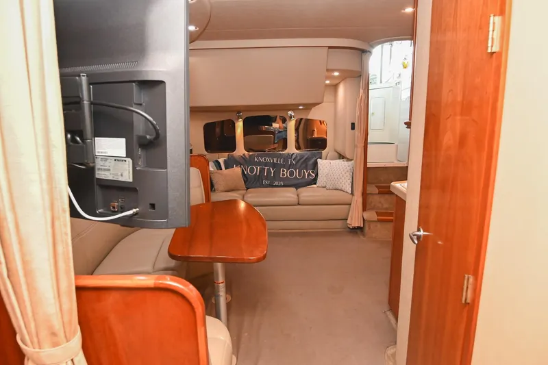 Slide: The Image of Interior of 2005 Cruisers Yachts 370 Express, featuring cozy seating and modern amenities. - 66