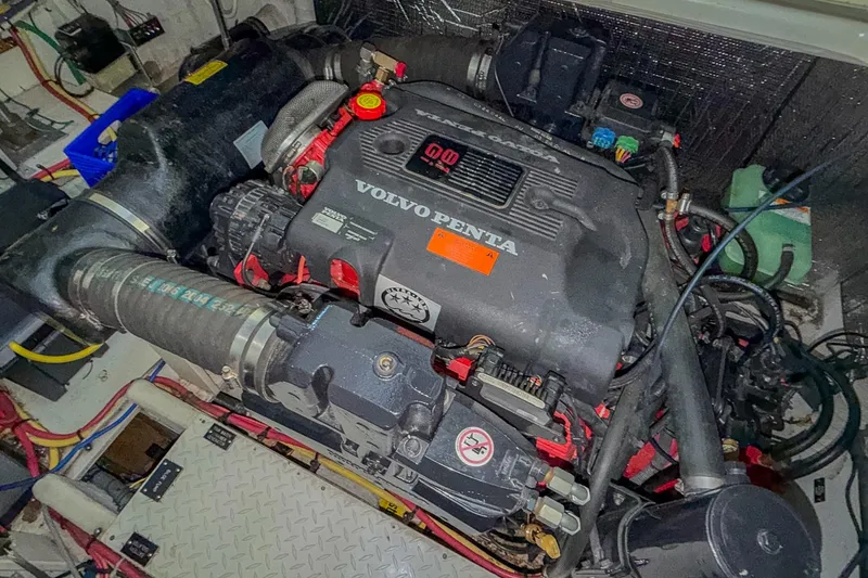 Slide: The Image of Engine compartment of a 2005 Cruisers Yachts 370 Express with Volvo Penta engine. - 69