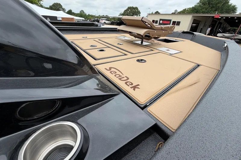 Slide: The Image of 2026 Xpress H18 Bass boat with SeaDek flooring, showcasing sleek design and functionality. - 4