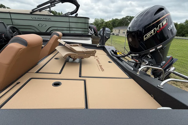 Slide: The Image of 2026 Xpress H18 Bass boat with Yamaha engine, featuring tan seating and deck. - 8