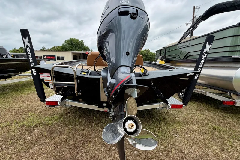 Slide: The Image of 2026 Xpress H18 Bass boat rear view with motor and propeller. - 9