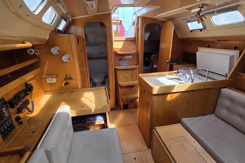 Slide: The Image of Interior of 1988 Beneteau Oceanis 350with wooden finishes looking aft - 2
