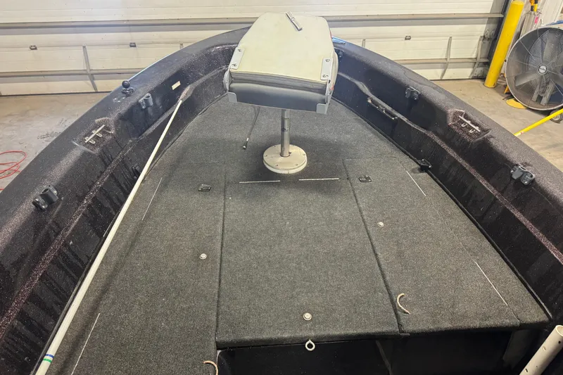 Slide: The Image of 2002 Tracker Targa 2000 boat interior with seating and storage compartments. - 10