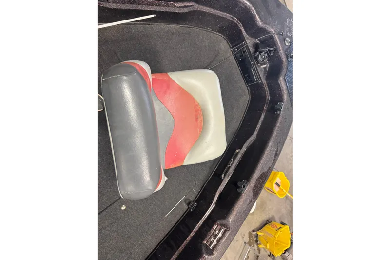 Slide: The Image of Interior of 2002 Tracker Targa 2000 boat with red and gray seating. - 11