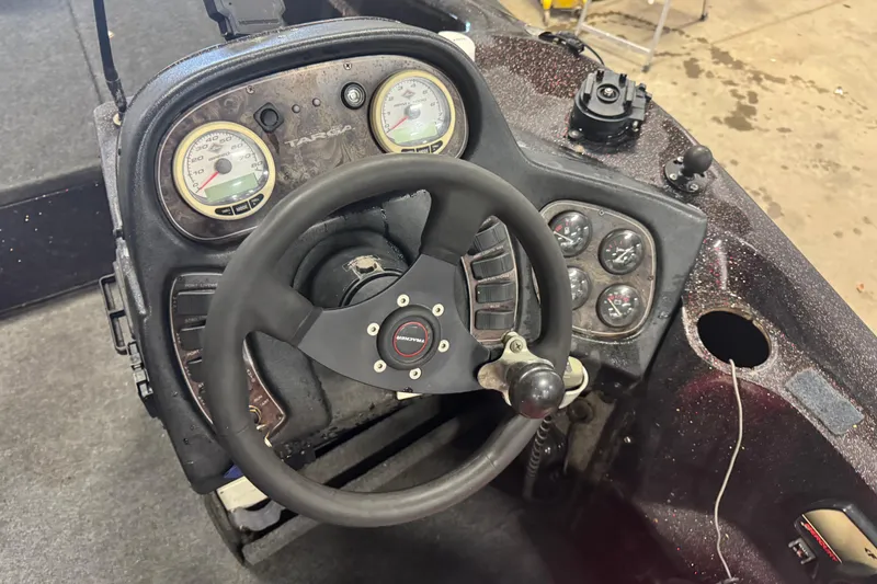 Slide: The Image of Steering console of a 2002 Tracker Targa 2000 boat with gauges and controls. - 6